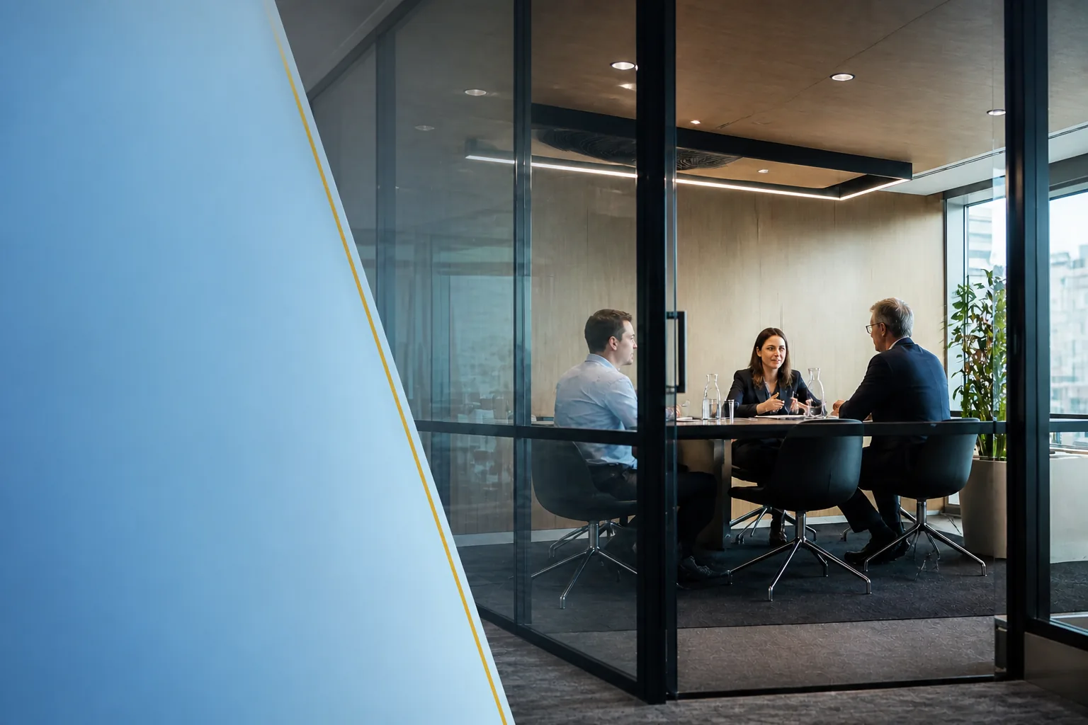Professionals meeting in a contemporary glass office